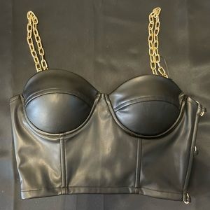 Chain link strap crop top with side cut outs.